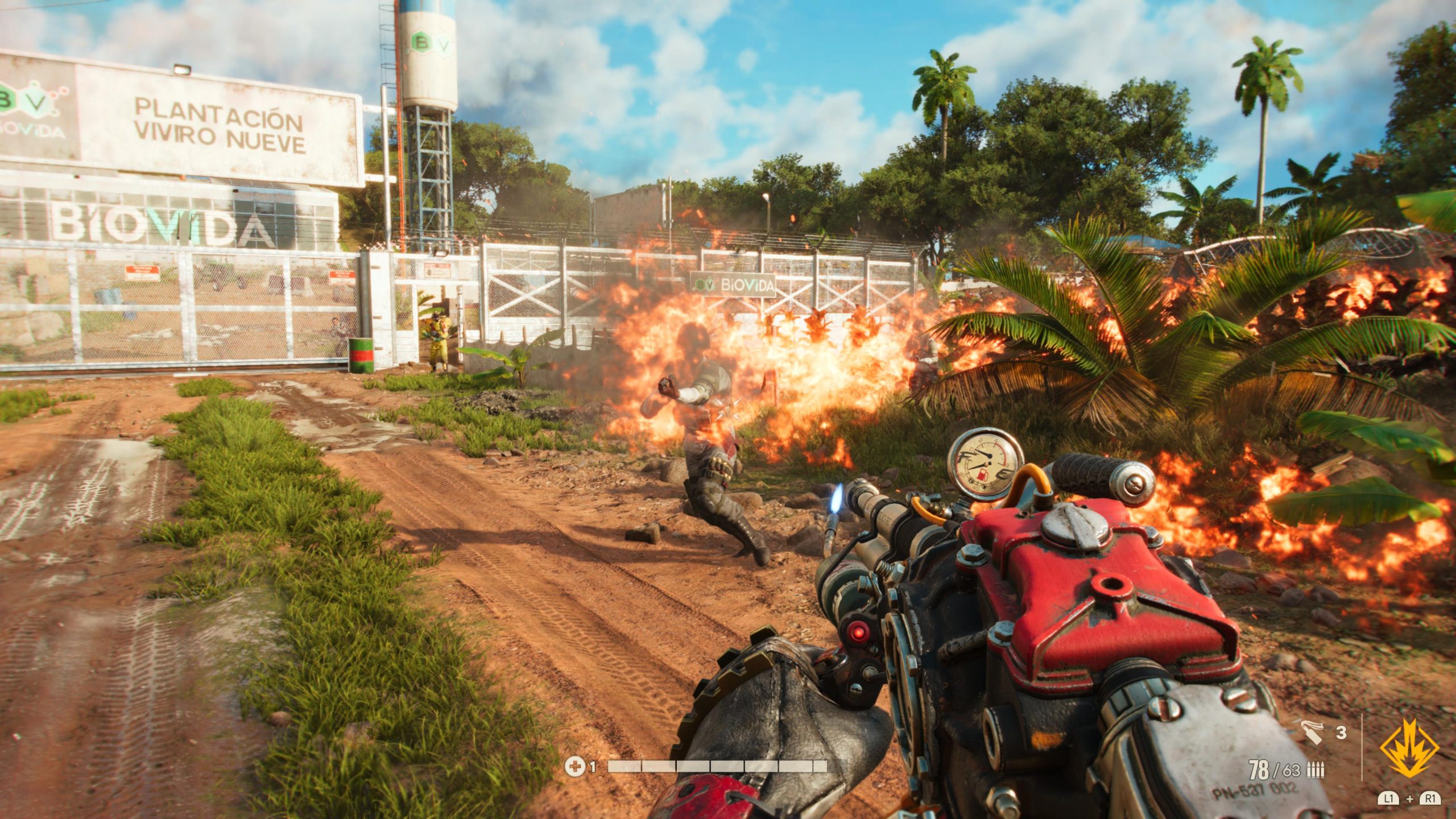 A screenshot from Far Cry 6. The camera is in first person and depicts a soldier being burned by a flame thrower while standing in a field.